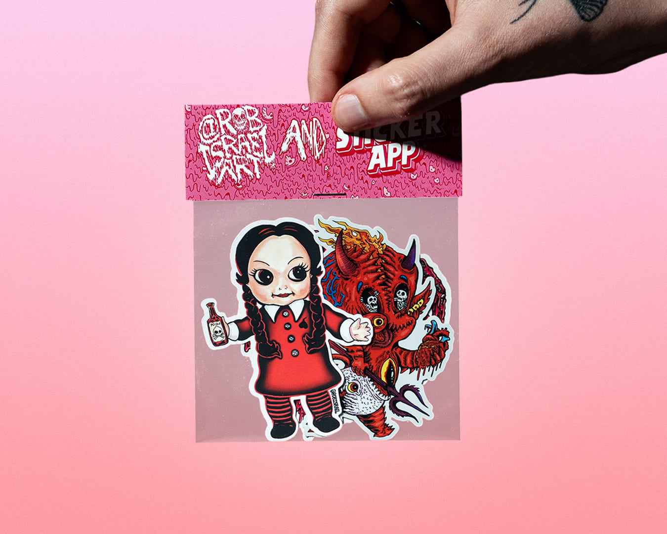 A hand holding a stickerpack