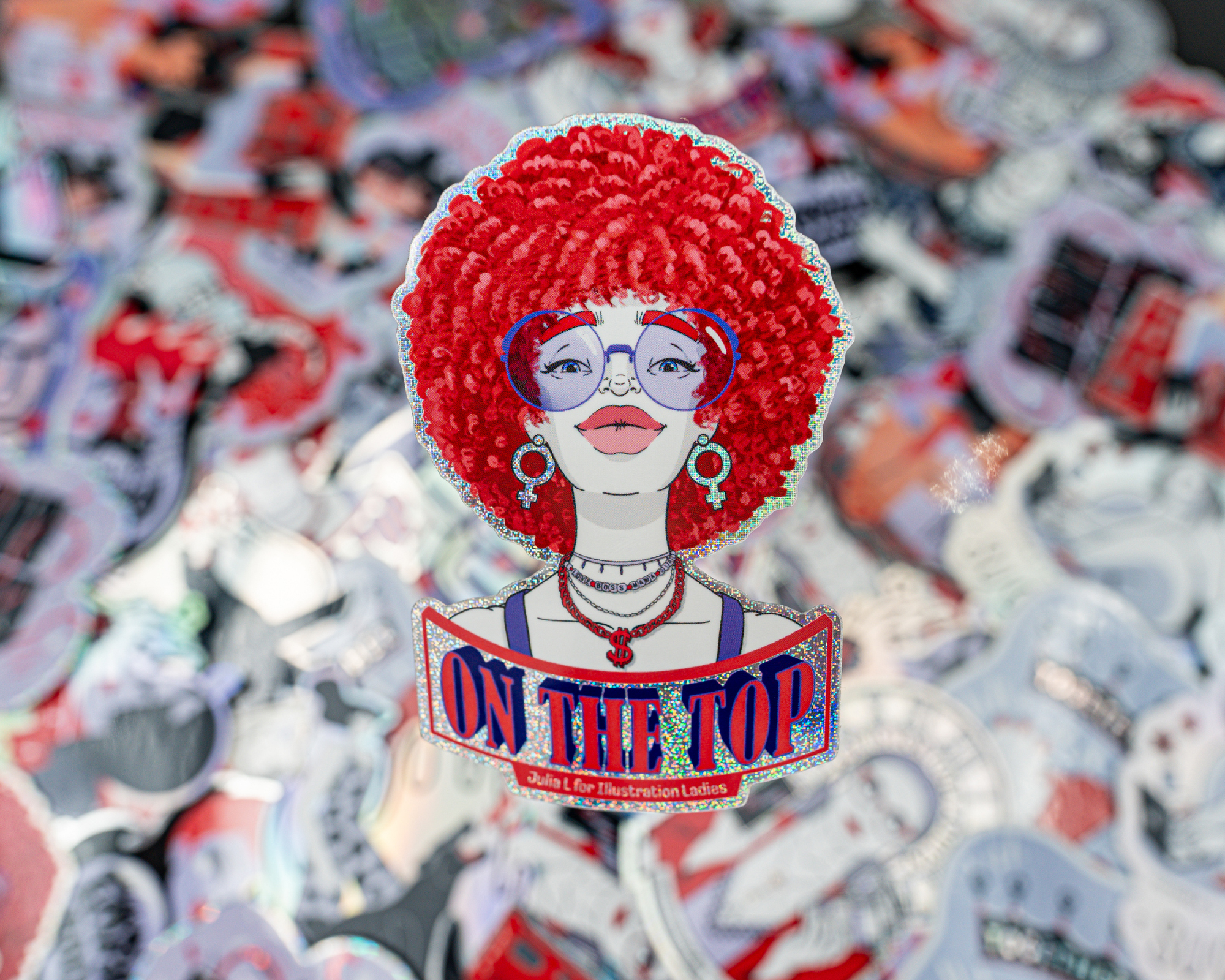 Die cut Sticker of a woman with red afro, glasses, and jewelry, with "ON THE TOP" text, against a background of various colorful stickers.
